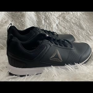 Reebok, men’s tennis shoes.